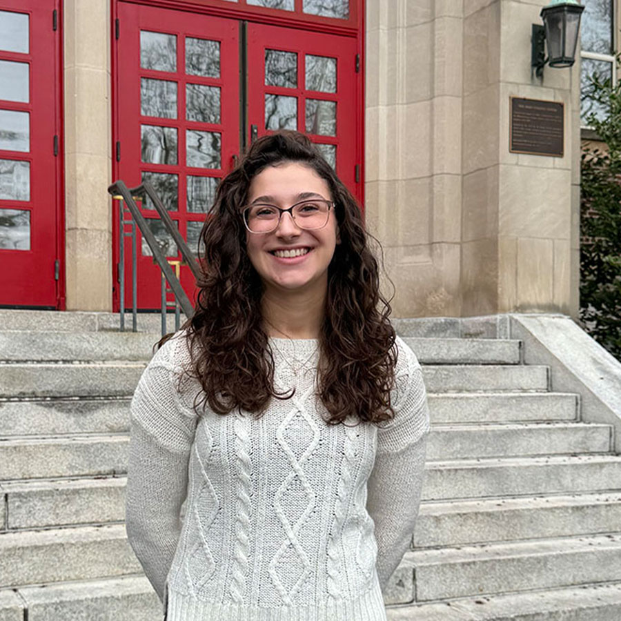 Carlee Davidson smiles while standing on the campus of Muhlenberg College.