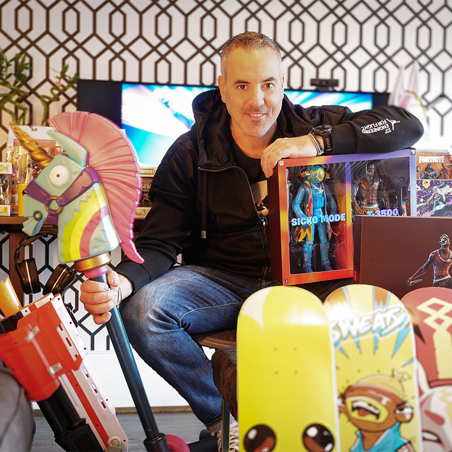 Phil Rampulla surrounded by memorabilia associated with Epic Games and Fortnite